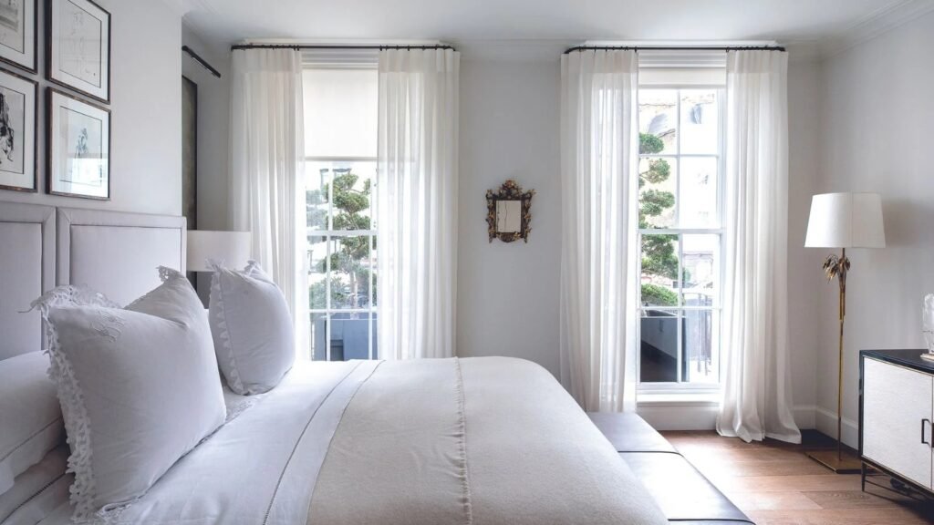 Use Curtains and Bedding to Make the Room Feel Taller